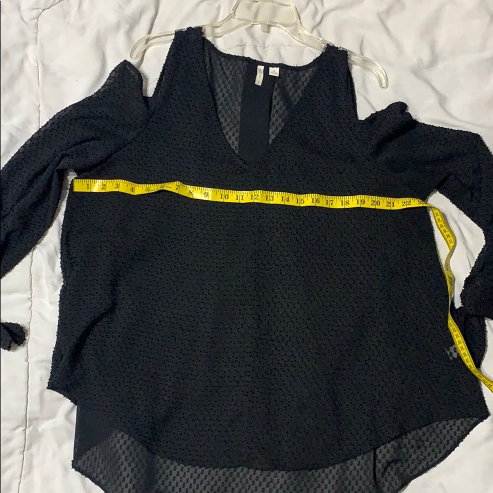 Long sleeve cold shoulder tunic blouse.